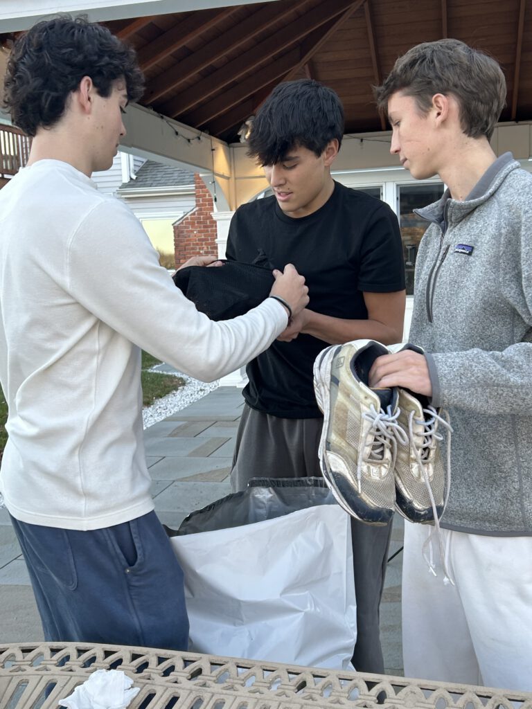 Teen volunteers collecting donated sneakers to support families at Ronald McDonald House of Connecticut