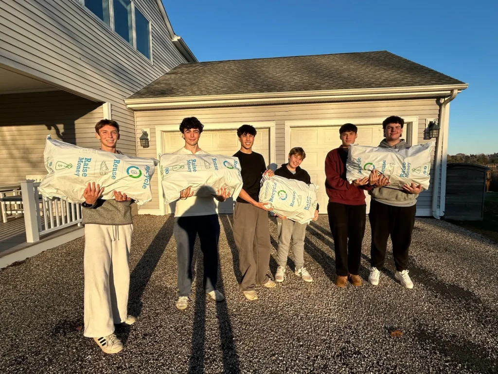 Teen volunteers collecting donated sneakers to support families at Ronald McDonald House of Connecticut